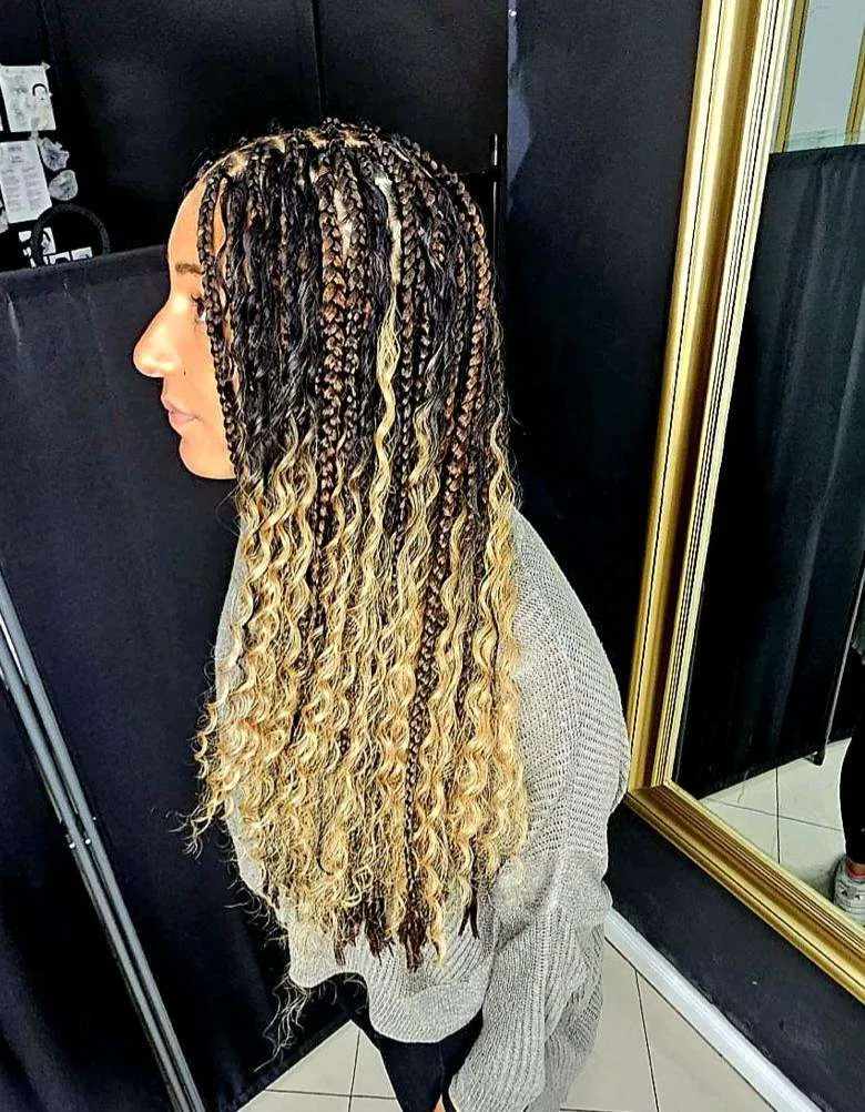 Long blonde and dark braids styled at Zaina’s Hair Studio